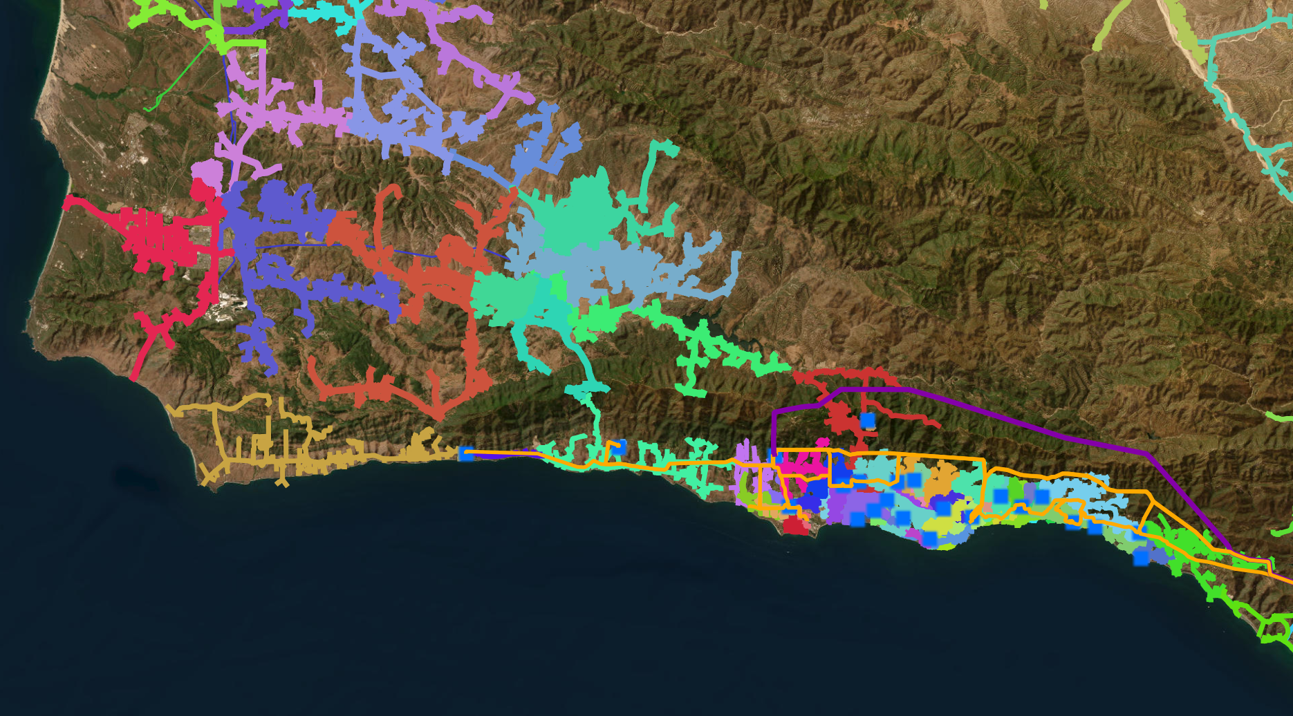 Screenshot of QGIS showing a satellite view of Santa Barbara County with multiple colors of power networks overlaid, color denoting circuits and thickness denoting Transmission vs Distribution.